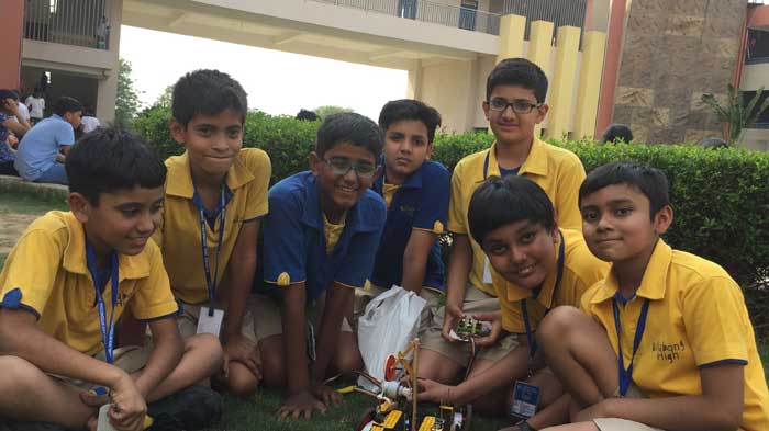 Students of Billabong High International School, Noida, with their scientific model made from junk
