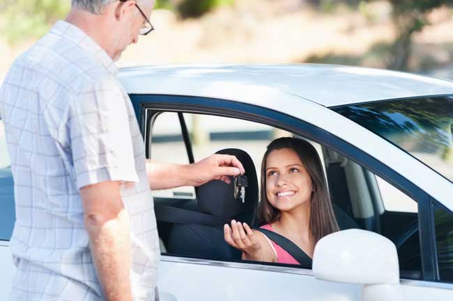 Teen getting car keys from father