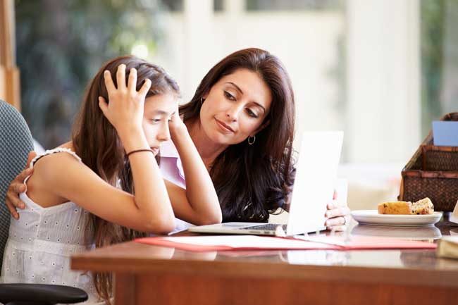 Mother helping stressed teen daughter