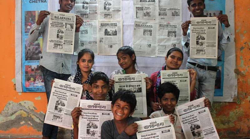 Editorial team of Balaknama holding up their newspaper