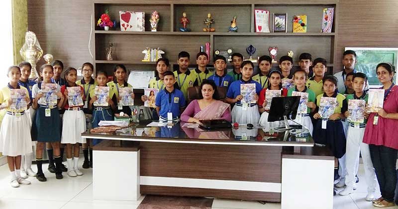 Dr Harleen Kaur, Principal of Mount Carmel International School, Naraiangarh, with students holding up copies of The Teenager Today
