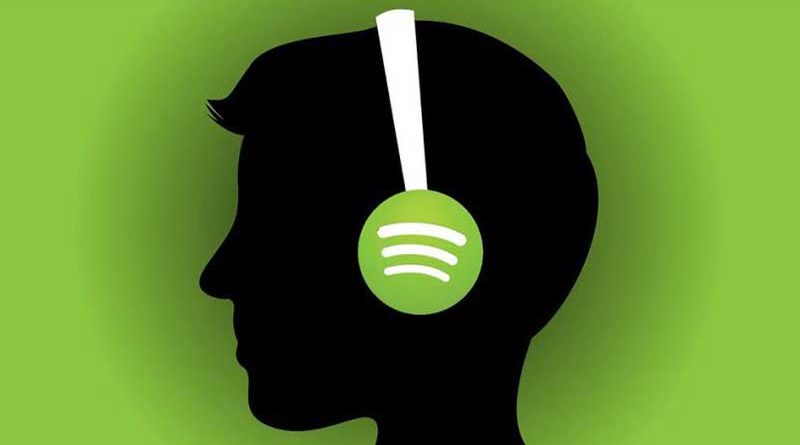 Silhouette of a man's head wearing headphones with Spotify logo