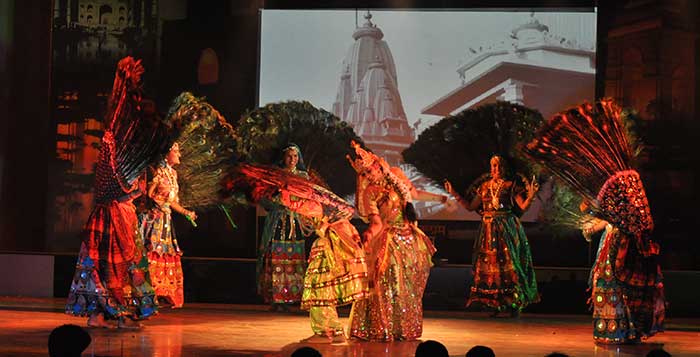 Women performing the Mayur dance on stage