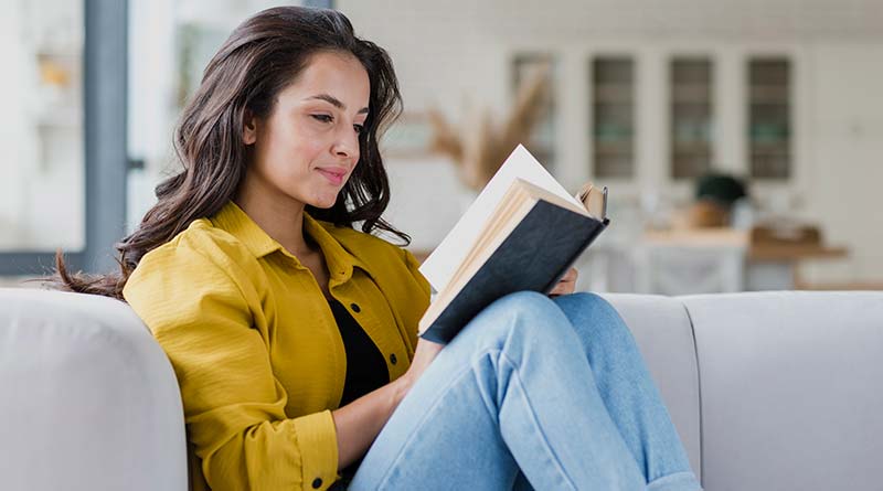 Young woman reading books