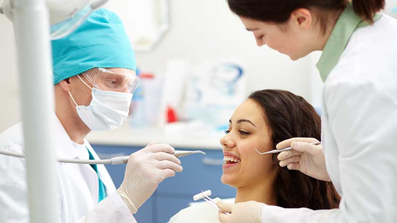 Dentists with female patient