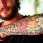 Man with forearm tattoo