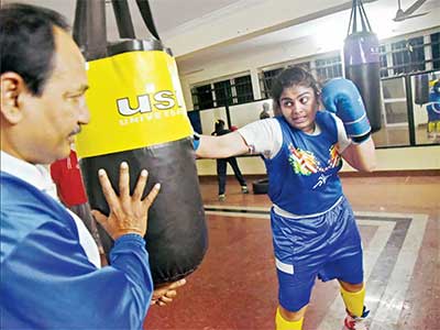 Alfiya practising and sparring with coach Ganesh Purohit