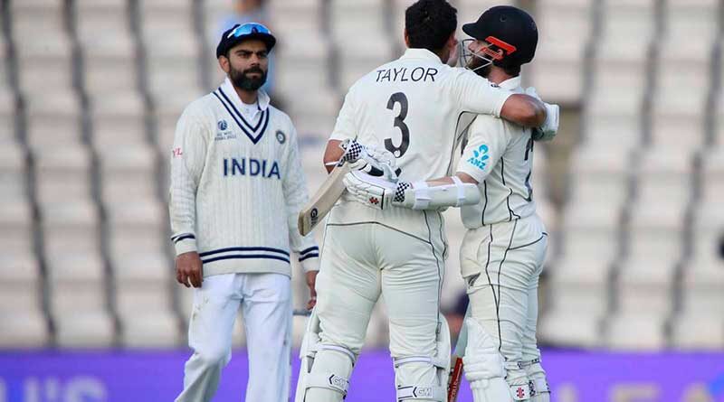 Virat Kohli watches as New Zealand captain Kane Williamson (right), and Ross Taylor celebrate their win