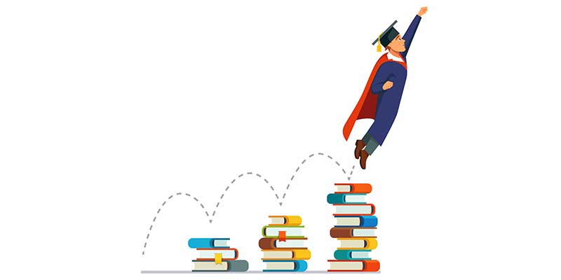 graduate leaping over books to success