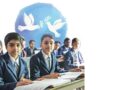 School students with peace doves in the background