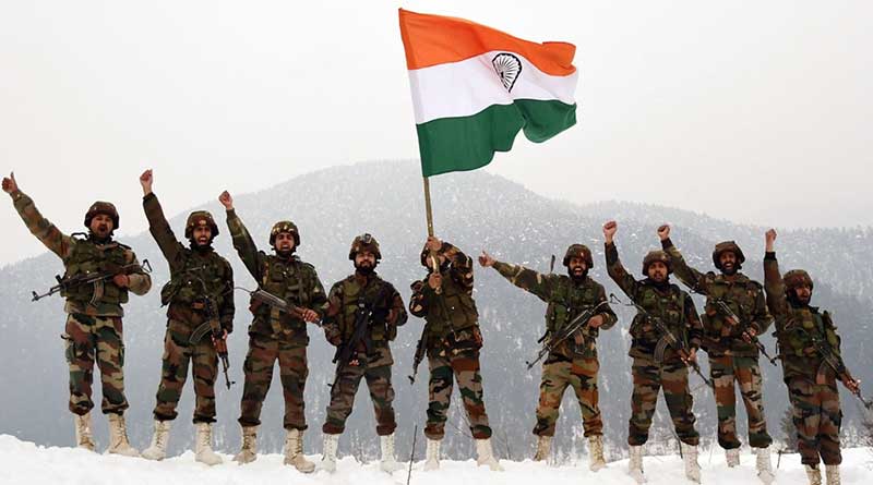 Indian Army holding the Indian flag aloft
