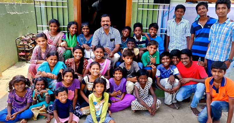 Solomon Raja with some of the children at the Shelter in Red Hills, Chennai