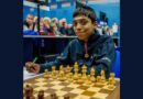 Pragganandhaa sitting near a chess board