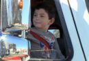 Noah Woods riding in a fire engine