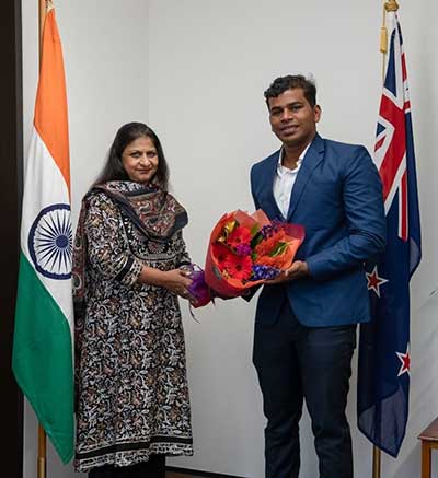 The High Commissioner of India to New Zealand, Neeta Bhushan, felicitates Prabhat Koli after he completed the Oceans Seven Challenge