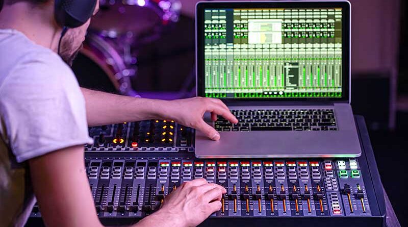 Digital mixer recording studio with computer recording the music.