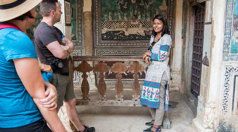 Female tourist guide talking to tourists