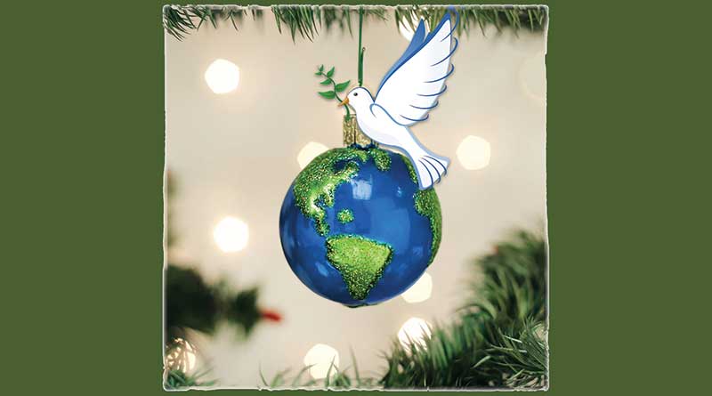 Earth-shaped Christmas globe with a peace dove perched on it